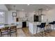 Updated kitchen with white cabinets, stainless steel appliances and breakfast bar at 544 E Morrow Dr, Phoenix, AZ 85024