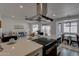 Modern kitchen with white cabinets, stainless steel appliances, and large island at 544 E Morrow Dr, Phoenix, AZ 85024