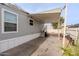 Side of manufactured home with covered patio and yard at 625 W Mckellips Rd # 213, Mesa, AZ 85201