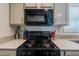 Updated kitchen with microwave and gas range at 625 W Mckellips Rd # 213, Mesa, AZ 85201