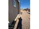 Rear exterior view showing AC unit and gravel at 652 S Ellsworth Rd # 170, Mesa, AZ 85208