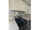 Kitchen with stainless steel range hood and electric stove at 652 S Ellsworth Rd # 170, Mesa, AZ 85208