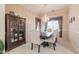 Elegant dining room with a chandelier and built-in hutch at 744 W Desert Broom Dr, Chandler, AZ 85248