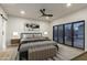 Modern bedroom with sliding glass doors to the pool area and a neutral color palette at 8544 E Heatherbrae Ave, Scottsdale, AZ 85251