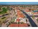 Aerial view of a neighborhood near a golf course with mountain views at 10633 E Michigan Ave, Sun Lakes, AZ 85248