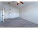 Spacious bedroom with ceiling fan and double closets at 10633 E Michigan Ave, Sun Lakes, AZ 85248