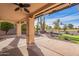 Spacious covered patio, overlooking a beautifully landscaped backyard at 10633 E Michigan Ave, Sun Lakes, AZ 85248