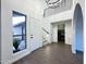 Bright entryway with staircase, chandelier, and laundry access at 1520 W Jacinto Ave, Mesa, AZ 85202