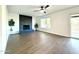 Living room with fireplace, wood-look floors and sliding glass door at 1520 W Jacinto Ave, Mesa, AZ 85202