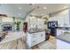 Kitchen with white cabinets, granite countertops, and view of living area at 1550 E Redfield Rd, Phoenix, AZ 85022