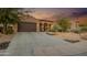 Well-maintained landscaping and a two-car garage at 1616 W Sierra Sunset Trl, Phoenix, AZ 85085