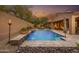 Stunning pool and spa with a waterfall feature and landscaped surroundings at 1616 W Sierra Sunset Trl, Phoenix, AZ 85085