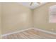 Simple bedroom with wood-look floors and ceiling fan at 16629 N 169Th Ave, Surprise, AZ 85388