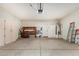 Garage with storage shelving and cabinets at 16629 N 169Th Ave, Surprise, AZ 85388