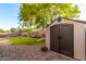 Large storage shed in a landscaped backyard setting at 17769 W Alexandria Way, Surprise, AZ 85388
