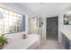 Bathroom with soaking tub, shower and double vanity at 17769 W Alexandria Way, Surprise, AZ 85388