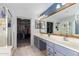 Bathroom with double vanity, large mirror and shower at 17769 W Alexandria Way, Surprise, AZ 85388