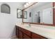 Clean bathroom with wood cabinets and large mirror at 17769 W Alexandria Way, Surprise, AZ 85388