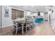 Charming dining area with rustic farmhouse table and seating for eight at 17769 W Alexandria Way, Surprise, AZ 85388