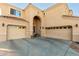 Two-story house with a three-car garage and arched entryway at 17769 W Alexandria Way, Surprise, AZ 85388