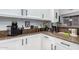 Modern kitchen with granite countertops and white shaker cabinets at 17769 W Alexandria Way, Surprise, AZ 85388