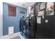 Convenient laundry room with washer, dryer, and extra storage at 17769 W Alexandria Way, Surprise, AZ 85388