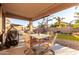 Covered patio with seating area and BBQ grill at 17769 W Alexandria Way, Surprise, AZ 85388