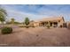 View of backyard with gravel, a pergola, and artificial turf at 24612 S Starcrest Dr, Sun Lakes, AZ 85248