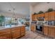 Kitchen features stainless steel appliances and oak cabinets at 24612 S Starcrest Dr, Sun Lakes, AZ 85248