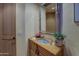 Elegant powder room with ornate mirror and unique sink at 3110 Arroyo Hondo --, Carefree, AZ 85377