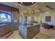 Island kitchen with granite countertops, custom cabinetry, and access to patio at 3110 Arroyo Hondo --, Carefree, AZ 85377