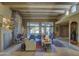 Living room featuring a stone fireplace, wood beams, and southwestern decor at 3110 Arroyo Hondo --, Carefree, AZ 85377