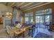Open living room with a large stone fireplace and access to the pool area at 3110 Arroyo Hondo --, Carefree, AZ 85377