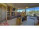 Main bedroom with built-in shelving, fireplace, and access to private patio at 3110 Arroyo Hondo --, Carefree, AZ 85377