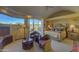 Spacious main bedroom with sitting area, access to patio, and king-size bed at 3110 Arroyo Hondo --, Carefree, AZ 85377