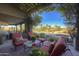 Covered patio with seating area and view of the pool at 3110 Arroyo Hondo --, Carefree, AZ 85377