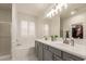 Elegant bathroom with double vanity and soaking tub at 3844 E Frances Ln, Gilbert, AZ 85295