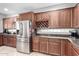 Kitchen with stainless steel refrigerator and wine rack at 4458 S Marion Pl, Chandler, AZ 85249