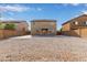 Large gravel backyard with a two-story house at 4644 W Lemon Ave, Coolidge, AZ 85128