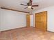 Bedroom with terracotta tile floors and double doors to closet at 5428 E Yolantha St, Cave Creek, AZ 85331