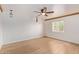 Bright bedroom with ceiling fan and hardwood floors at 5428 E Yolantha St, Cave Creek, AZ 85331