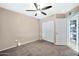 Bedroom with double door closet and ceiling fan at 590 W 12Th St, Florence, AZ 85132