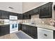 Modern kitchen featuring dark wood cabinets and granite countertops at 590 W 12Th St, Florence, AZ 85132