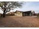 Large backyard with gravel landscaping and mature tree at 723 W 5Th Ave, Apache Junction, AZ 85120
