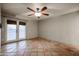Bedroom with tile floors, french doors and ceiling fan at 723 W 5Th Ave, Apache Junction, AZ 85120