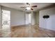 Bedroom with tile floor, bathroom access and ceiling fan at 723 W 5Th Ave, Apache Junction, AZ 85120