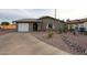 Charming single story home with a landscaped front yard at 723 W 5Th Ave, Apache Junction, AZ 85120