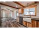 Open concept kitchen with farmhouse sink and wood flooring at 723 W 5Th Ave, Apache Junction, AZ 85120