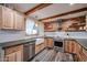 Modern kitchen features stainless steel appliances and a farmhouse sink at 723 W 5Th Ave, Apache Junction, AZ 85120