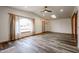 Bright and airy living room with wood-look floors and arched window at 723 W 5Th Ave, Apache Junction, AZ 85120